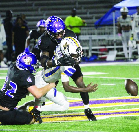 The Greyhounds defense forces a first-quarter fumble that was recovered by Tyrese Dean. BRAD HARRISON/Staff
