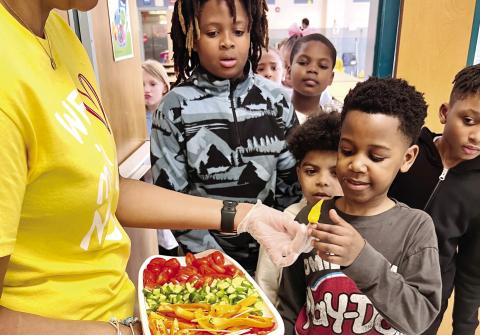 Students at Mattie Wells Elementary School try samples of sweet peppers, cucumbers and tomatoes during the taste test. ALAINA CLARKE/Staff