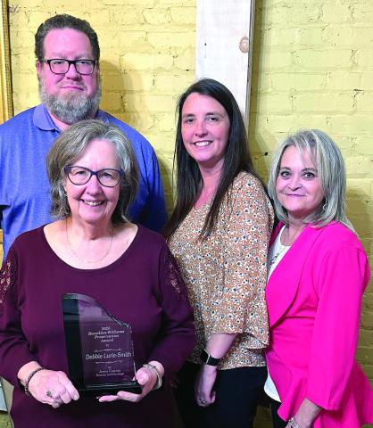 Award winner Debbie Lurie-Smith (front) with (l-r) Josh Lurie, Jennifer Gibson and Sharon Ruff. CONTRIBUTED
