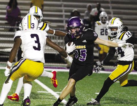 Will Keenum (15) hauls in a pass in the midst of traffic against Eagles Landing. BRAD HARRISON/Staff