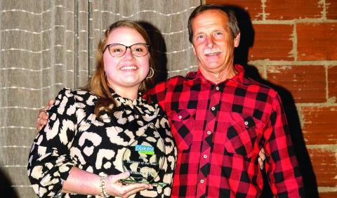 Jesse Bloodworth and father David accept the 2025 Business of the Year award. Chloe Scarborough/CONTRIBUTED