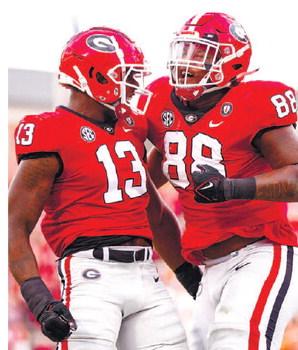Georgia defensive linemen Mykel Williams (13) and Jalen Carter (88) celebrate during the win against Tennessee. TONY WALSH/UGA Athletics