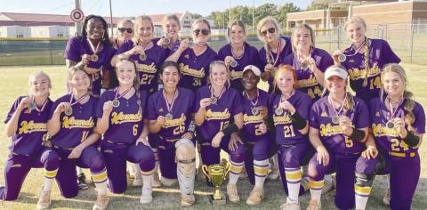 The Lady Greyhounds pose with the championship trophy after last week’s region tournament victory. BRAD HARRISON/Staff