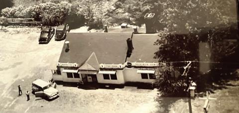 Cleo’s Restaurant before it burned. Roberts is one of the youngsters close to the car. CONTRIBUTED