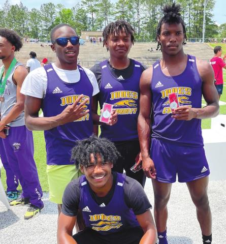 The Greyhounds relay team of Zion Ragins, Javious Bond, Tyler Stewart, and Ed Chester pose with one of their two medals on Saturday. They placed second in the state in both the 4x200 and 4x100 relays. BRAD HARRISON/Staff