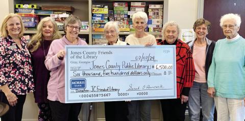 Members of Jones County Friends of the Library presented a check for $6,500, representing the money they earned from their monthly second Saturday book sales, to the Library Board of Trustees at their Feb. 7 meeting. CONTRIBUTED