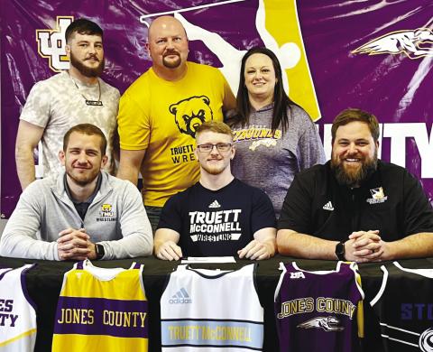 Greyhounds wrestler Chi Anderson poses after signing with Truett McConnell last week. BRAD HARRISON/Staff