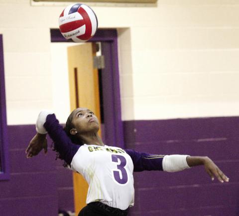 Ziyan Miller powers the serve up and over the net against Union Grove. BRAD HARRISON/Staff
