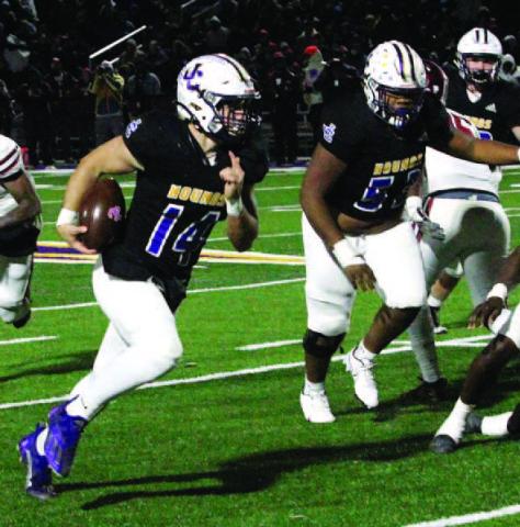 Backup quarterback Connor Bass finds space to gain yardage in the second half against Warner Robins in 2021. BRAD HARRISON/File photo