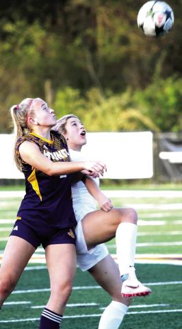 Caroline Rickman battles for position to move the ball upfield against Locust Grove. BRAD HARRISON/Staff