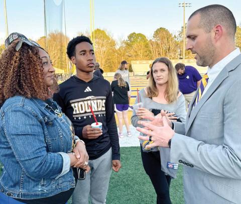 New Greyhounds head football coach Justin Montgomery met with countless players and families at the end of Thursday’s event. BRAD HARRISON/Staff