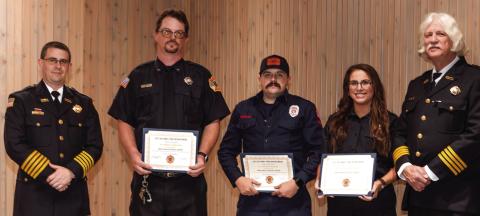 GFD Chief Keith Eisele (l) and Deputy Chief Carl Zimmer (far right) present Meritorious awards to firefighters Ernest Faircloth (next left then l-r) , Patrick Peebles and Caroline Thompson at the Dec. 19 awards ceremony held at Butler Hall. CONTRIBUTED