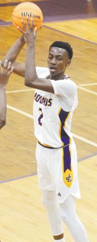 Rudy Bowden looks to dish the ball inside against Warner Robins. BRAD HARRISON/Staff
