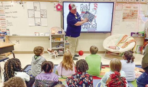 Justin Kelly, a local business owner, reads to a class at Gray Elementary School during Read Across Jones. CONTRIBUTED