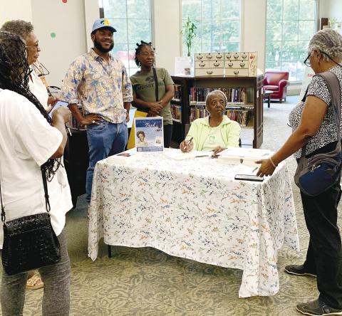 A book signing for Dr. Ruth Carter Hayes (seated) was hosted by the Jones County Library June 5. Hayes was born in New Jersey and moved to Jones County in the late 1990s. Her autobiography is titled, “If I Can, You Can” and is based on the story of her life. Hayes recently celebrated her 94th birthday. CONTRIBUTED