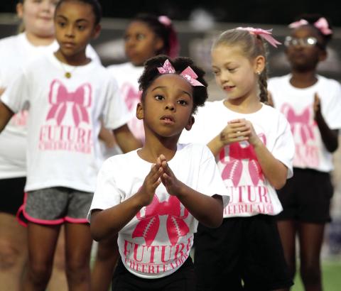 Pre-game scenes from future cheerleading clinic, rec night