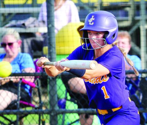 Marissa Moore gets ready to lay down an infield bunt against Locust Grove. BRAD HARRISON/Staff