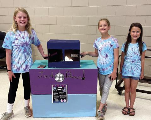 Three students at Turner Woods Elementary School create a Just Dance game using the wheel and axle. CONTRIBUTED