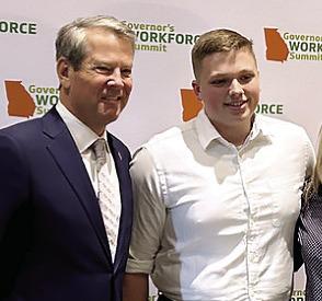 Carson Greene with Georgia Gov. Brian Kemp at a workforce summit held in Atlanta. CONTRIBUTED