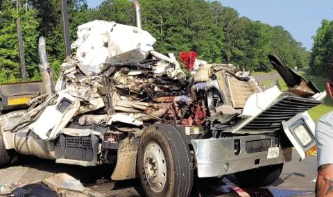 The driver of this log truck involved in the June 30 accident amazingly survived. CONTRIBUTED
