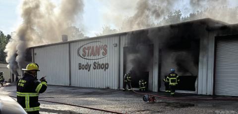 Smoke poured from the Stan’s Body Shop building when firefighters arrived the morning of July 6. CONTRIBUTED
