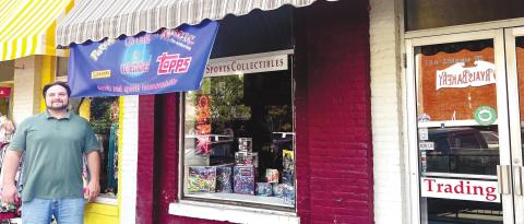 Chris Jameson, the owner of CJ’s Cards and Collectibles, outside of his shop in Milledgeville.