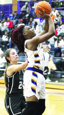 Kamiyah Adams goes up for two points on Friday against Houston County. BRAD HARRISON/Staff