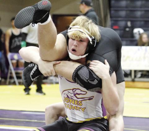 Hunter Hardwick maintains leverage against his opponent during Saturday’s group of matches of JCHS. BRAD HARRISON/Staff
