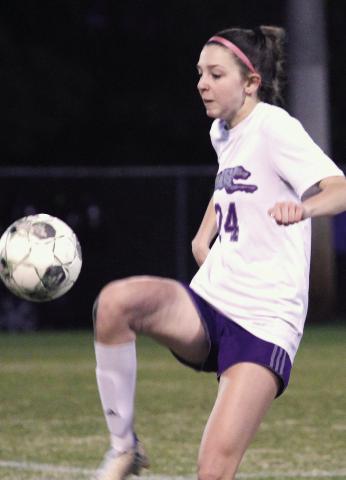 Kalyn Knight possesses the ball before moving it upfield against Mary Persons. BRAD HARRISON/Staff