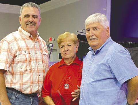 Deputy Chief Thomas Coleman (left) and Chief Don Graham with Pat Harker, who received her 35-years of volunteer service award.