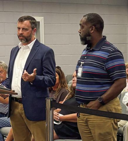 GDOT engineers Tyler Peek (left) and Danny Miller at the July 21 meeting. DEBBIE LURIE-SMITH/ Staff