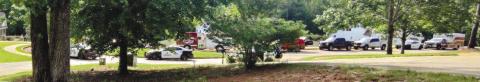 Law enforcement and medical personnel vehicles at the Tingen home following the discovery of his death. COURTESY OF THE MONROE COUNTY REPORTER