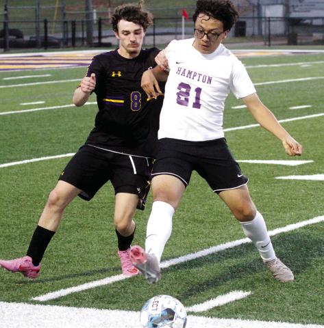 Jackson Durden fights for possession of the ball against Hampton. BRAD HARRISON/Staff