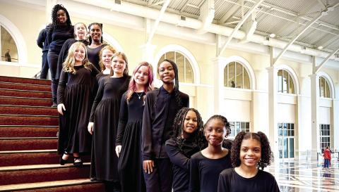 Jones County’s Elementary Honor Chorus students line the stairway of the Classic Center Theatre in Athens. CONTRIBUTED