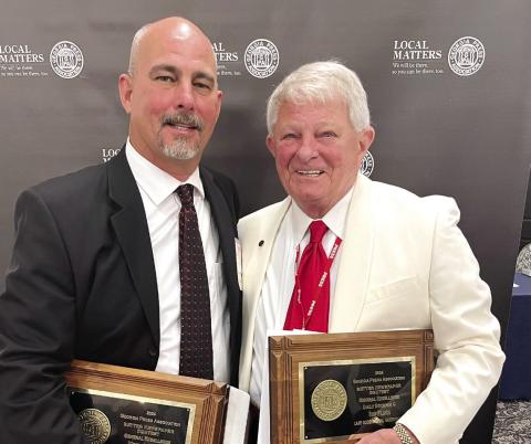 Smith Communications Inc. General Manager Matt Smith (left) and President/CEO A. Mark Smith Sr. accepted nearly 50 awards on behalf of the company’s newspapers and magazines. CONTRIBUTED