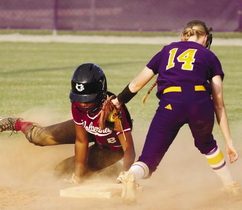 Kimber Kent (14) applies the tag as a Union Grove runner tries to steal second during last week’s regular-season finale against Union Grove. BRAD HARRISON/Staff