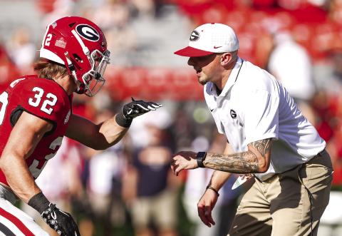 Georgia running back Cash Jones (32) with assistant head coach and tight ends coach Todd Hartley before Georgia’s game against UT Martin Saturday, Sept. 2. TONY WALSH/UGAAA