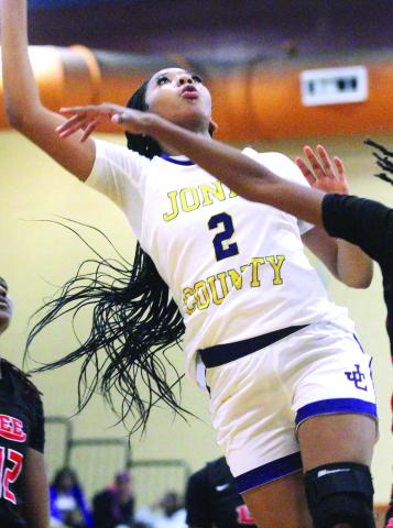 Desirae Dumas fights for an offensive rebound against Lee County. BRAD HARRISON/Staff