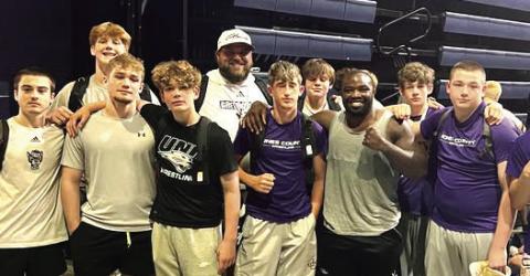 Greyhound wrestlers got a chance to visit with former JCHS standout and UFC fighter Torrez Finney during last month’s camp in Chattanooga. CONTRIBUTED