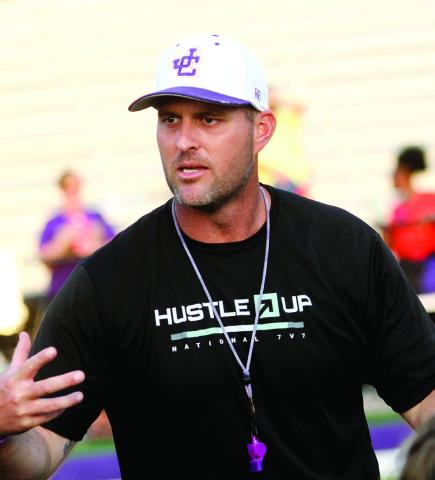 Greyhounds head football coach Justin Montgomery addresses the team during a practice this past season. BRAD HARRISON/Staff