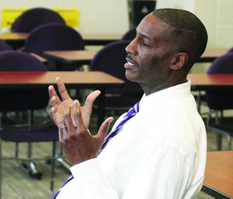 New Greyhounds boys basketball head coach Willie Reese shares his vision for the program with Greyhound players. BRAD HARRISON/Staff