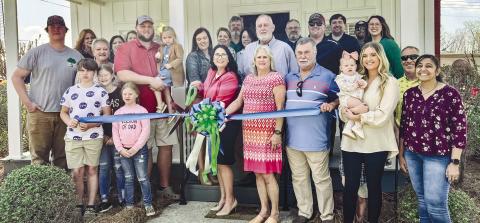 Kaitlin Hinson with Hinson Law Firm cutting her ribbon during the ribbon cutting ceremony with the Gray/Jones Chamber of Commerce. ALAINA CLARKE/Staff