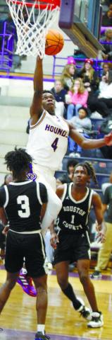 Greyhounds guard Kaden Douglas lays the ball in for two points against Houston County. BRAD HARRISON/Staff