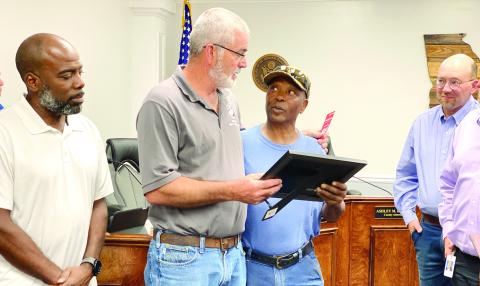 Chairman Chris Weidner presents a commendation from the county to Albert Bonner, who received the Employee of the Year award from the American Public Works Association. DEBBIE LURIE-SMITH/Staff