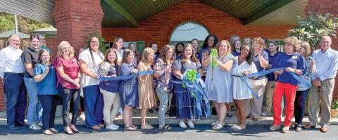 The ribbon cutting for Willoway Preschool is celebrated by the Jones County/Gray Chamber of Commerce and Main Street Gray Sept. 24 at its location at 133 Bill Conn Parkway. Executive Director Ashley Williams is surrounded by staff and chamber members as she cuts the ribbon. Williams said the Gray location is the first of three for the company to open, and the estimated opening date is Oct. 27. For more information, go to www.willowaypreschool.com or call 478-219-8760. DEBBIE LURIE-SMITH/Staff