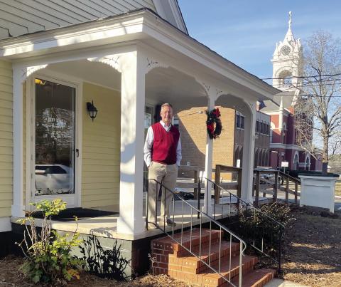 King in front of his pre-1900 office. GREENBERRY MOORE/Staff