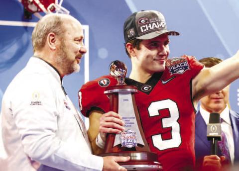 Georgia quarterback Stetson Bennett (13) was resilient after a tough start against Ohio State. On Georgia’s last two drives of the game, Bennett completed 5-of-5 passes for 148 yards and two TDs. He also passed for 190 yards in the fourth quarter. TONY WALSH/UGA Athletics