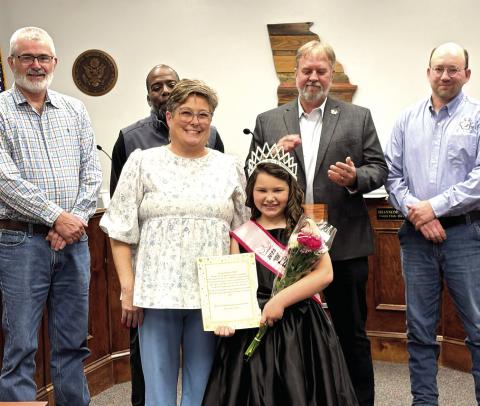 Little Miss Royal USA Fisher Ann Reynolds is celebrated by commissioners at their Feb. 4 board meeting. DEBBIE LURIE-SMITH/Staff