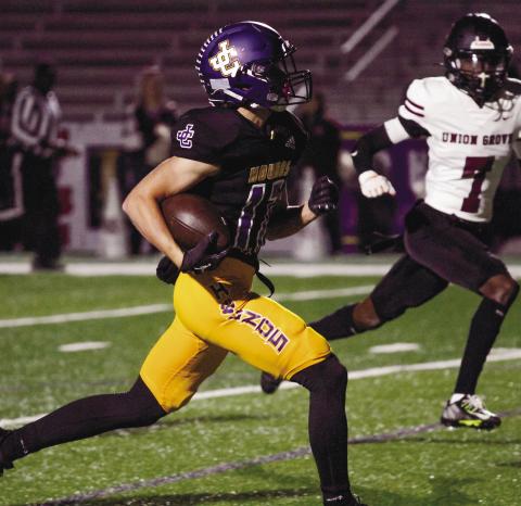 Greyhounds receiver Cohen Barfield runs to the end zone for a touchdown during Thursday’s 41-7 senior night win over Union Grove. Jones County opens the playoffs Friday at home against Northside Columbus. 