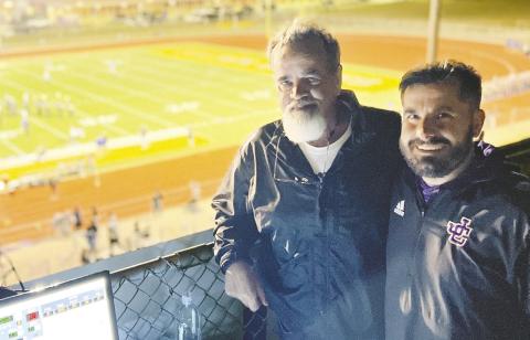 Adam Greene (right) calls one of last season’s games at Greyhound Field with his father, Al Greene, who played football at JCHS. CONTRIBUTED